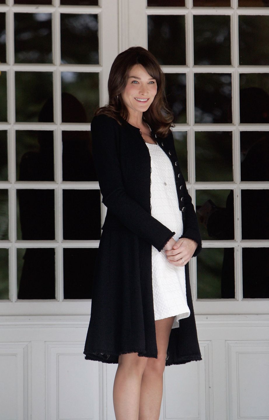 DEAUVILLE, FRANCE - MAY 26:  French First Lady Carla Bruni-Sarkozy waits for the spouses of the Heads of Delegation participating in the G8 Summit on May 26, 2011 in Deauville, France. Heads of the of the world's wealthiest nations have gathered in Deauville to meet for a two-day G8 summit, chaired by French President Nicolas Sarkozy, with the Arab spring expected to top the agenda. (Photo by Franck Prevel/Getty Images) 