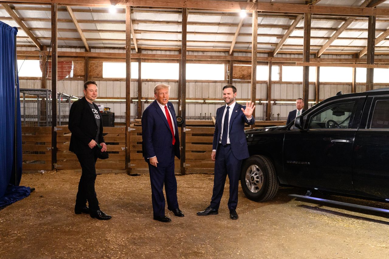 Former US President Donald Trump, center, and Senator JD Vance, right, a Republican from Ohio and Republican vice-presidential nominee, greet Elon Musk, chief executive officer of Tesla Inc., backstage prior to a campaign event at the Butler Farm Show in Butler, Pennsylvania, US, on Saturday, Oct. 5, 2024. Elon Musk will campaign with the former president on Saturday, joining a rally at the scene of a summer assassination attempt and cementing his role as one of the Republican candidate's key backers. Photographer: Justin Merriman/Bloomberg via Getty Images