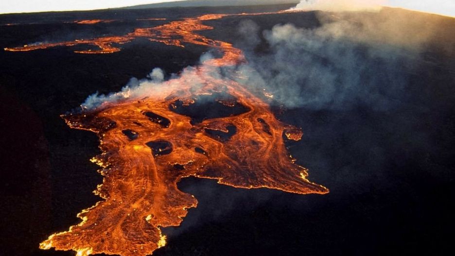 Temporary
This aerial image released by the US Geological Survey (USGS) on November 28, 2022 courtesy of the National Weather Service, shows the lava in the summit caldera of Mauna Loa in Hawaii, which is erupting for the first time in nearly 40 years. - Hawaii's Mauna Loa, the largest active volcano in the world, has erupted for the first time in nearly 40 years, US authorities said, as emergency crews went on alert early Monday. (Photo by Handout / US Geological Survey / AFP) / RESTRICTED TO EDITORIAL USE - MANDATORY CREDIT "AFP PHOTO / US Geological Survey " - NO MARKETING - NO ADVERTISING CAMPAIGNS - DISTRIBUTED AS A SERVICE TO CLIENTS
HANDOUT