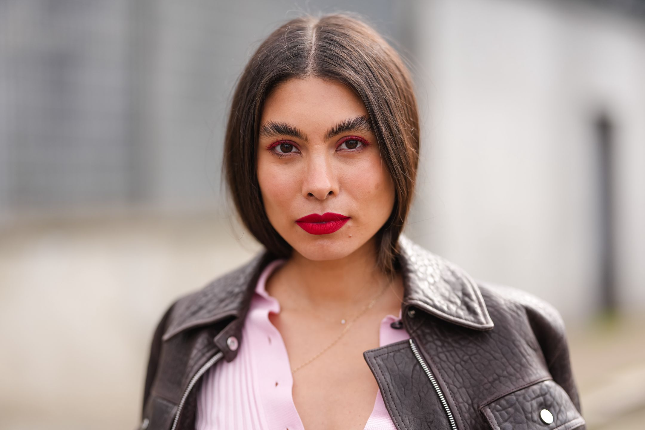MILAN, ITALY - MARCH 01: Fernanda Millan wears bright cherry red lipstick, fluffy eyebrows, outside Ferragamo, during the Milan Fashion week Women's Fall/Winter 2025-2026 on March 1, 2025 in Milan, Italy. (Photo by Edward Berthelot/Getty Images)