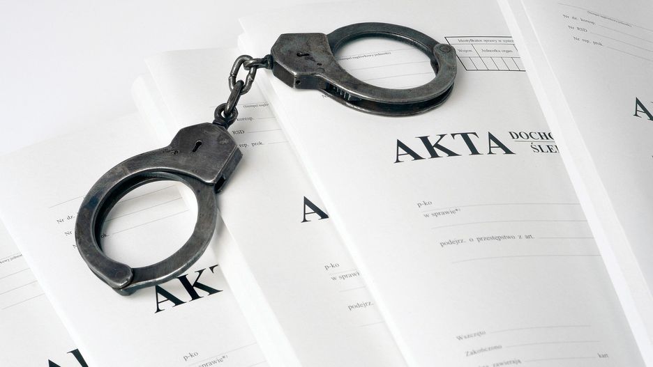 handcuffs and case file