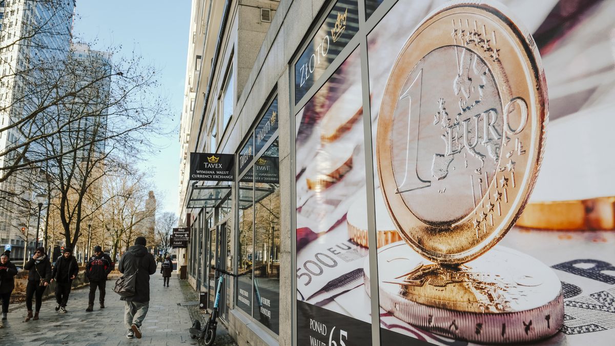 A euro coin illustration in the window of a building on Swietokrzyska street in central Warsaw, Poland, on Friday, Dec. 22, 2023. The central bank halted interest rate cuts after the Oct. 15 parliamentary election unexpectedly brought the pro-European Union opposition to power, along with their promises to boost budget spending. Photographer: Damian Lemaski/Bloomberg via Getty Images