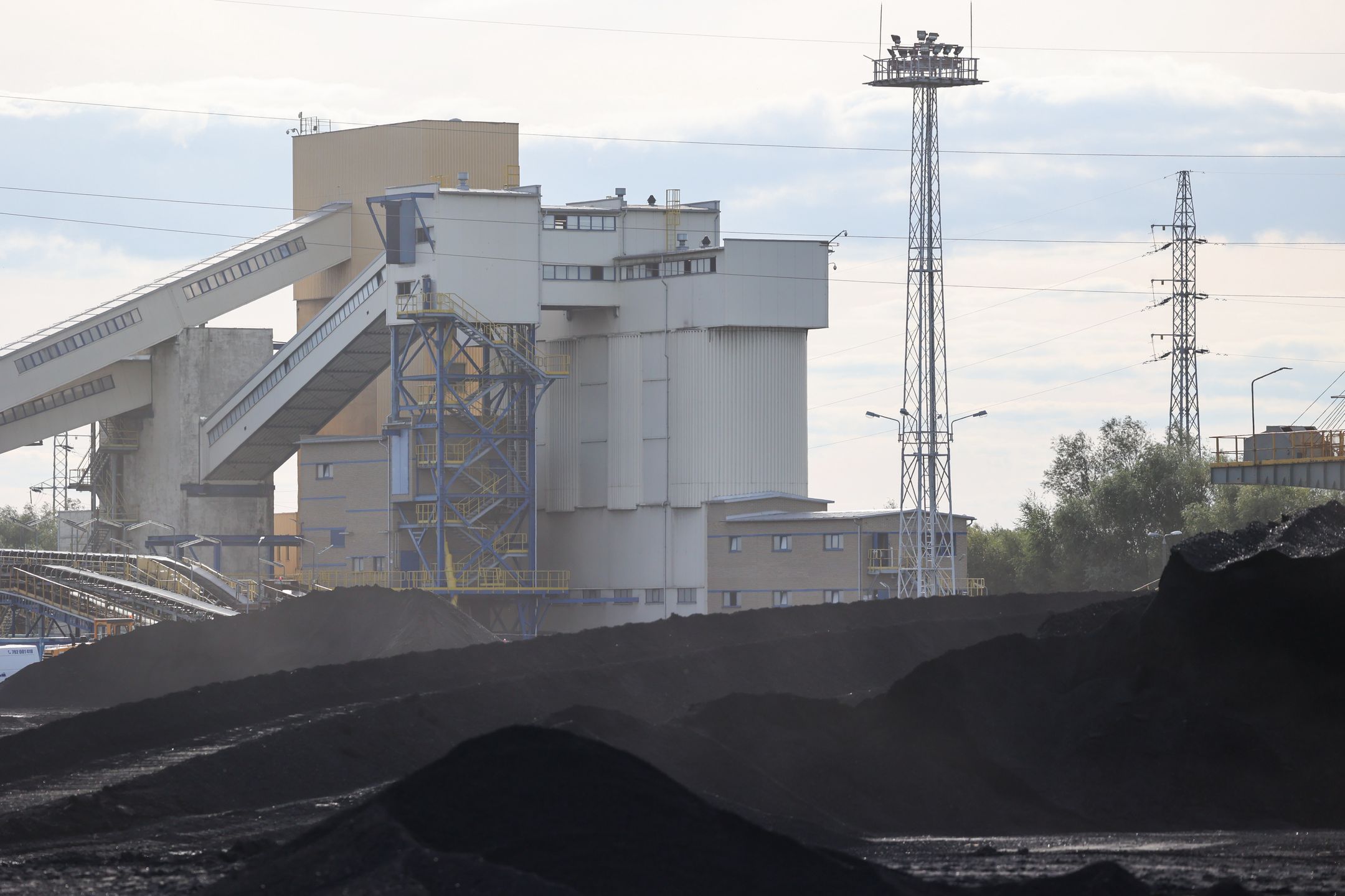 BOGDANKA, POLAND - AUGUST 31: View of the coal mine in Bogdanka, Poland on August 31, 2022. The growing demand for coal in Poland caused vehicle lines outside the mine's sales office. In recent days, the Bogdanka coal mine has introduced registrations for coal collection, which helped to reduce queues. (Photo by Jakub Porzycki/Anadolu Agency via Getty Images)