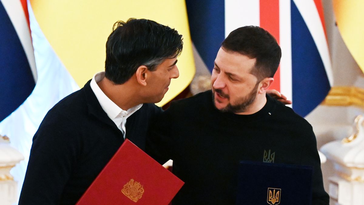 UK Prime Minister Rishi Sunak and President of Ukraine Volodymyr Zelensky are posing for journalists after signing the ''Agreement on Security Cooperation'' during their meeting in Kyiv, Ukraine, on January 12, 2024, amid Russia's invasion of Ukraine. President Zelensky and Prime Minister Sunak, who arrived in Kyiv on Friday, are holding negotiations and are signing the ''Agreement on Security Cooperation'' in the field of security. The agreement stipulates that in the event of a future Russian attack, Britain will quickly and without delay provide Ukraine with the necessary assistance, including modern weapons to repel aggression on land, sea, and airspace, as local media are reporting.  (Photo by STR/NurPhoto via Getty Images)