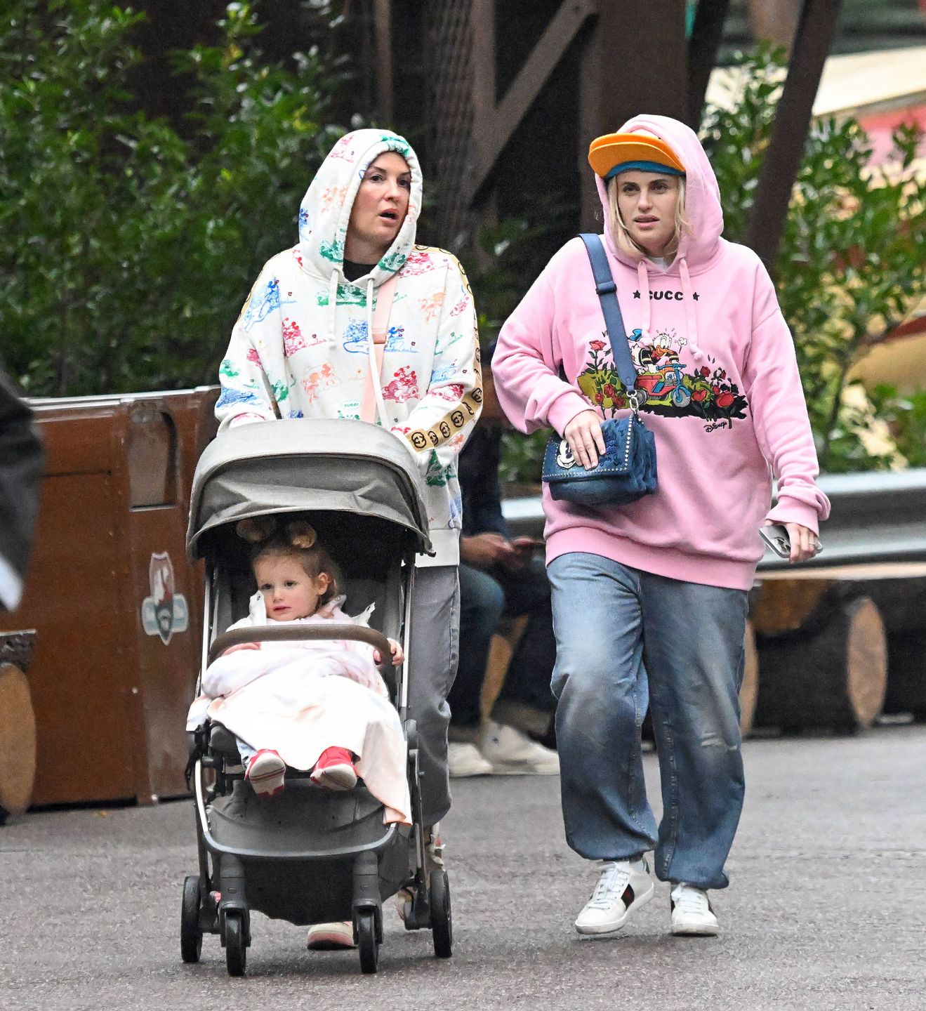 EXCLUSIVE: Rebel Wilson and her wife Romona take their daughter Royce to celebrate her 2nd birthday at the happiest place on earth, Disneyland
EXCLUSIVE: Rebel Wilson and her wife Romona take their daughter Royce to celebrate her 2nd birthday at the happiest place on earth, Disneyland. Rebel was seen wearing a Donald Duck Gucci sweater as well as a Donald Duck cap and baggy jeans. She kept a close eye on her daughter Royce throughout the day, riding many of the rides with her. Rebel was also seen wearing the Big Thunder Mountain with a group of friends since her little birthday girl was too small to ride. , The happy family wa also seen enjoying lunch at the very exclusive club 33 where they spent about two hours enjoying lunch. At the end of the day Rebel was seen putting her hood over her head as they were caught in a bit of a rain downpour, but that didnt appear to damper their mood as they made their way back to their hotel room at the Disney Grand Californian hotel.
02 Nov 2024,Image: 929785021, License: Rights-managed, Restrictions: World Rights, Model Release: no, Pictured: Rebel Wilson, Romona Agruma and Royce Wilson, Credit line: Snorlax / MEGA / The Mega Agency / Forum
Snorlax / MEGA / The Mega Agency / Forum
rides, didnt, baggy jeans, Disney Grand Californian hotel, Donald Duck cap, very exclusive club, little birthday girl, group of friends, hours, way, lunch, mood, head, hood, Disneyland, earth, Rebel, bit of a rain downpour, Donald Duck Gucci sweater, happy family wa, day, close eye, hotel room, wife Romona, 2nd birthday, Big Thunder Mountain, happiest place, daughter Royce, end of the day Rebel, Rebel Wilson