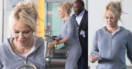 Wyluzowana Pamela Anderson walczy z bagażami na lotnisku