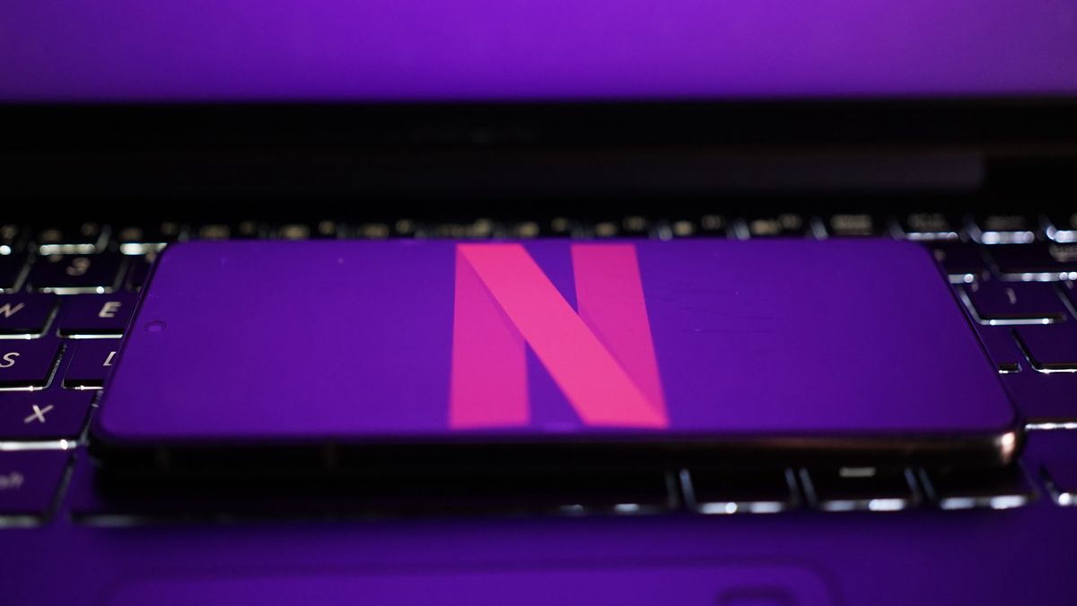 CHINA - 2024/09/07: In this photo illustration, Netflix logo is displayed on a smartphone with a laptop keyboard background. (Photo Illustration by Alvin Chan/SOPA Images/LightRocket via Getty Images)
