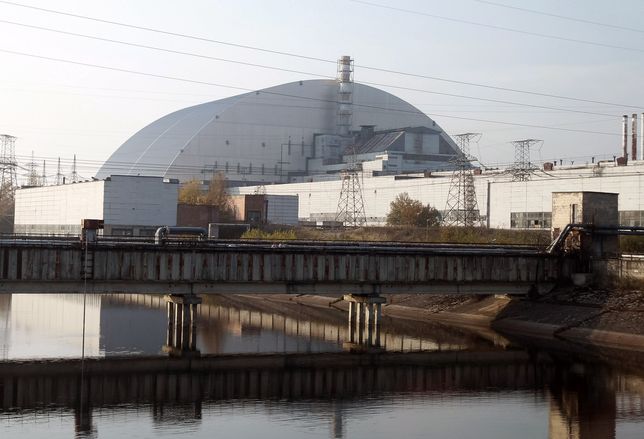 A view on the Safe Confinement over the 4th block of Chernobyl Nuclear power plant, during a press tour to Chernobyl Exclusion Zone in Chernobyl, Ukraine, on 23 October, 2019. The Chernobyl disaster that occurred on 26 April 1986 at the 4th block of the Chernobyl Nuclear Power Plant, near the city of Pripyat, is considered the worst nuclear disaster in history. (Photo by STR/NurPhoto via Getty Images)