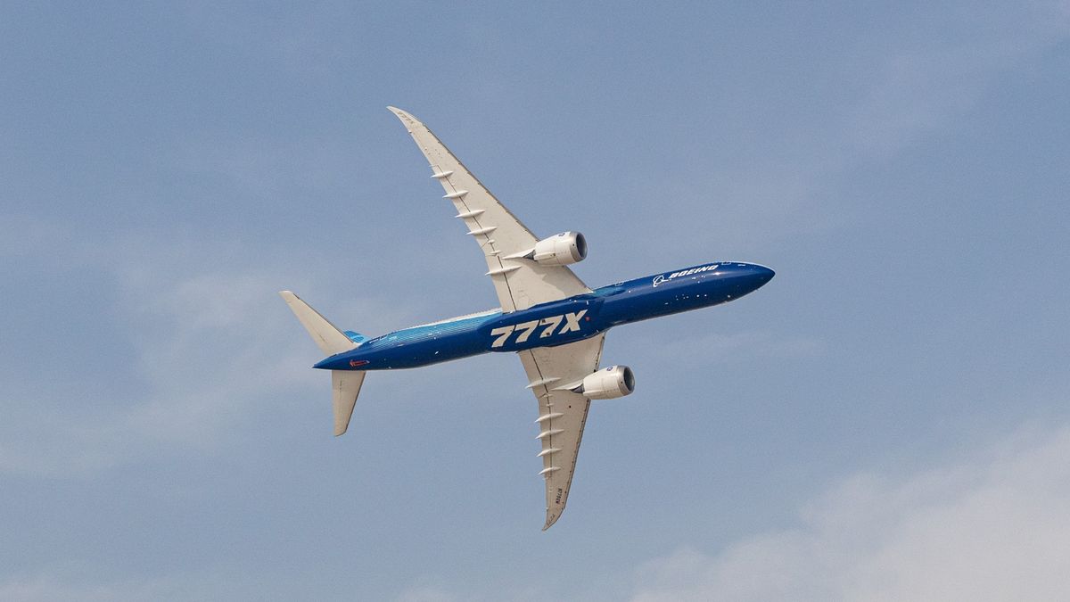 An experimental Boeing 777X aircraft at the Dubai Air Show in Dubai, United Arab Emirates, on Monday, Nov. 17, 2025. The airshow runs from Nov. 17-21, with expanded space and advanced air mobility pavilions this year. Photographer: Christopher Pike/Bloomberg via Getty Images