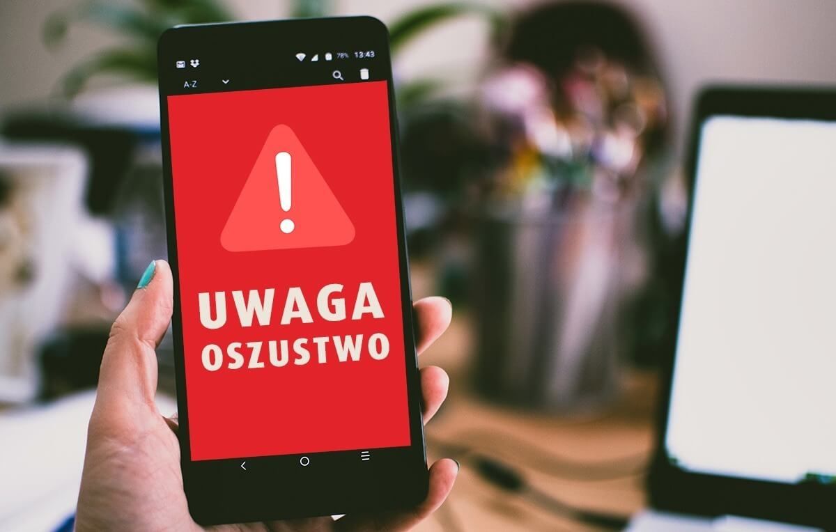 Telefon z napisem uwaga oszustwo