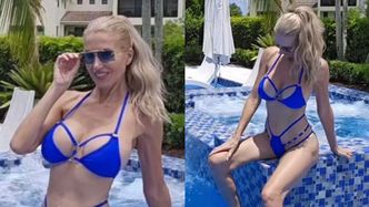 Odziana w niebieskie bikini Aneta Glam wygrzewa się nad basenem
