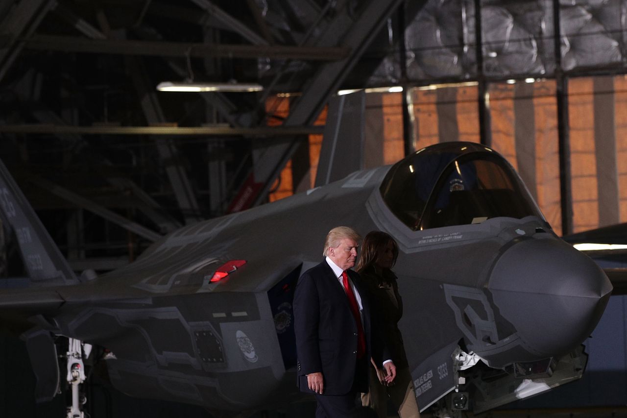 Donald Trump against the backdrop of an F-35 fighter jet