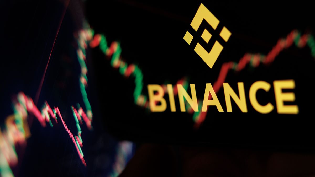 LONDON, ENGLAND - OCTOBER 30: In this photo illustration, the Binance logo is displayed on a phone screen adjacent to an image from a crypto exchange on a laptop on October 30, 2026 in London, England. The world's largest cryptocurrency exchange, Binance, experienced a $6.3 billion security exploit yesterday, representing the largest digital asset theft to date. The incident occurred when an unauthorised attacker drained funds from the exchange's hot wallets across 10 distinct blockchain networks within a 20-minute window. In response, Binance temporarily suspended all deposits and withdrawals, and co-founder Yi He confirmed that the exchange will fully cover all user losses using company assets. (Photo by Dan Kitwood/Getty Images)