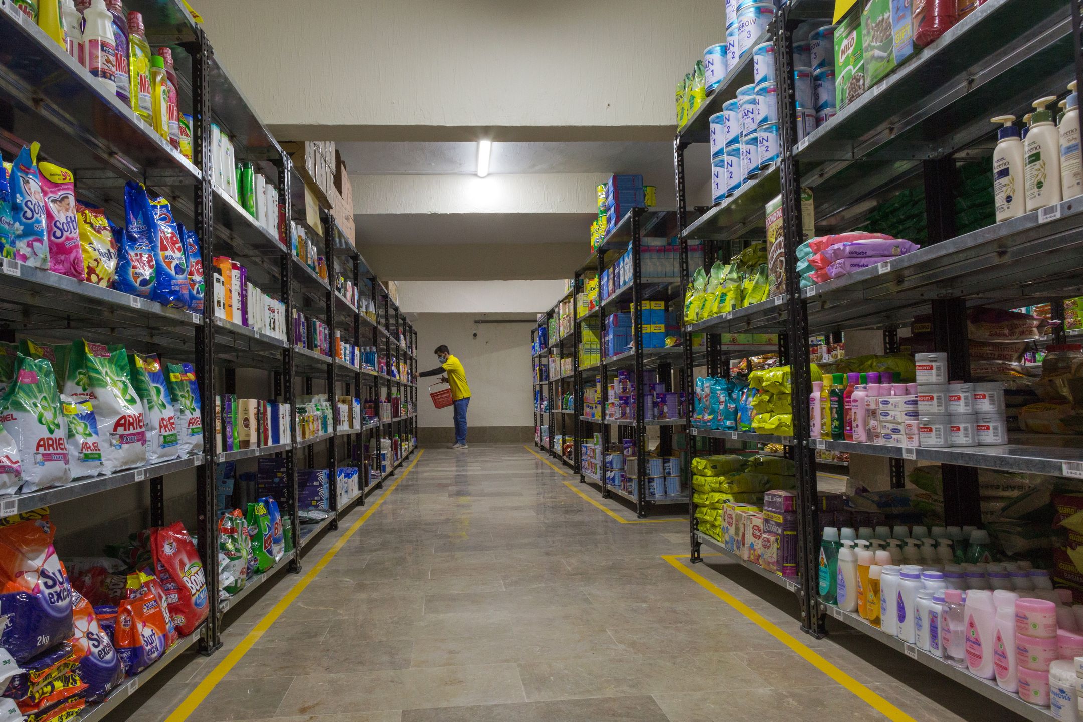 A Krave Mart worker collects items at one of the company's dark stores in Karachi, Pakistan, on Saturday, Dec. 11, 2021. Pakistan's rapid delivery startup Krave Mart has raised the country's largest early funding to grow its business in the worlds fifth-most populous nation. Photographer: Asim Hafeez/Bloomberg via Getty Images