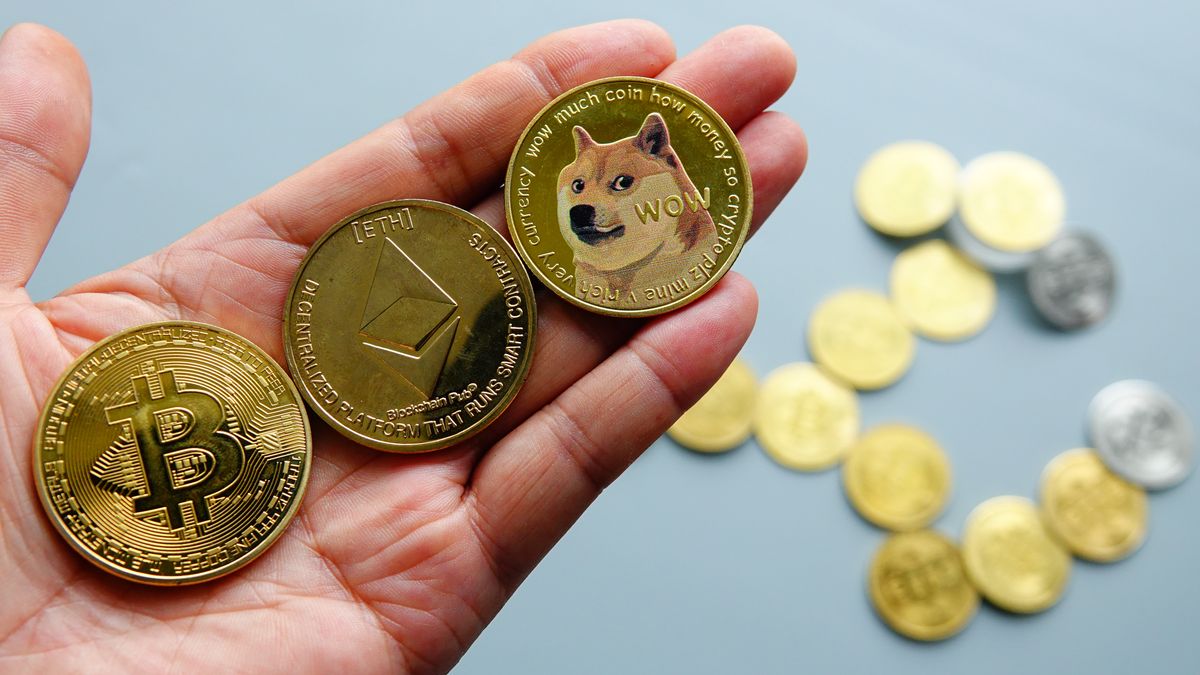YICHANG, CHINA - AUGUST 5, 2024 - Bitcoin, Ethereum and Dogecoin physical commemorative coins are displayed in Yichang, Hubei province, August 5, 2024. (Photo credit should read CFOTO/Future Publishing via Getty Images)