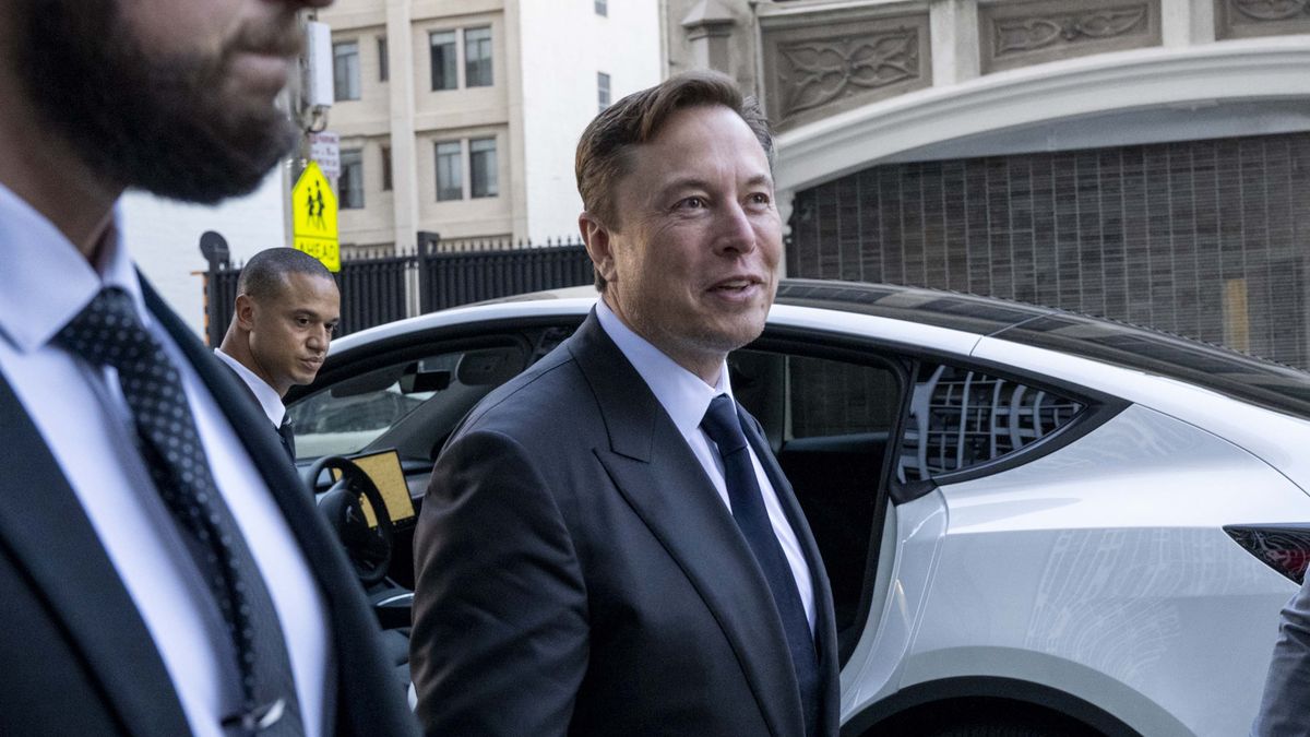Elon Musk, chief executive officer of Tesla Inc., center, departs court in San Francisco, California, US, on Tuesday, Jan. 24, 2023. Investors suing Tesla and Musk argue that his August 2018 tweets about taking Tesla private with funding secured were indisputably false and cost them billions of dollars by spurring wild swings in Tesla's stock price. Photographer: Marlena Sloss/Bloomberg via Getty Images