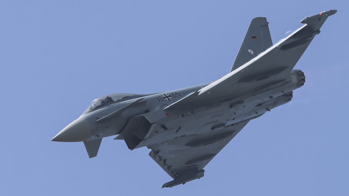 A Eurofighter Typhoon fighter jet of the German Air Force performs a flight demonstration during the 55th edition of the International Paris Air Show at the Salon international de l'aeronautique et de l'espace - SIAE. The EF200 or Eurofighter Typhoon is a European multinational twin engine, supersonic, delta wing multirole fighter made by the consortium of Airbus, BAE Systems and Leonardo. Paris, Le Bourget Airport, France on June 22, 2025 (Photo by Nicolas Economou/NurPhoto via Getty Images)
