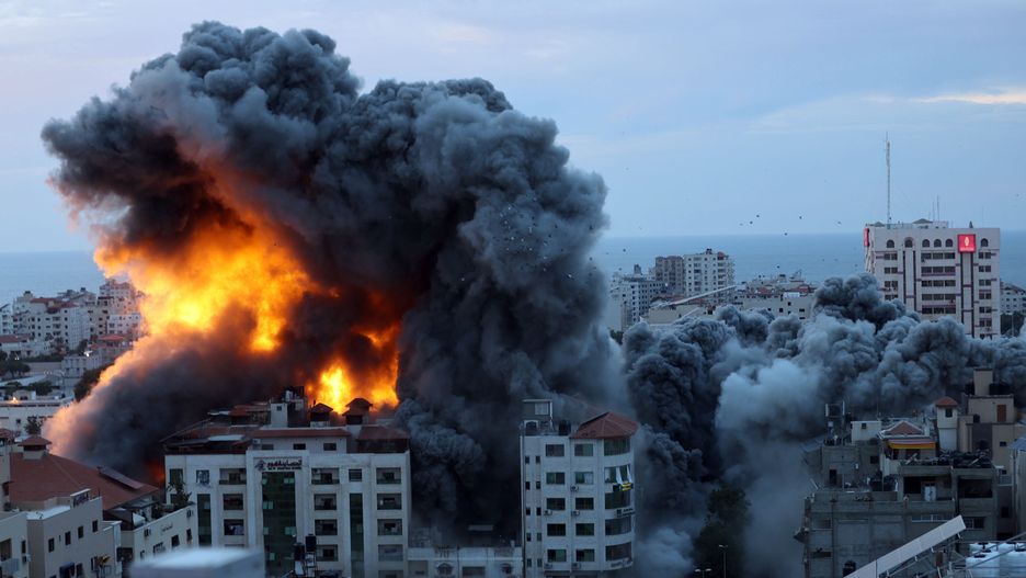 GAZA STRIP, GAZA - OCTOBER 07: Smoke and flames rise after Israeli air forces targeting a shopping center in Gaza Strip, Gaza on October 07, 2023. Declaring a "state of readiness" for war, the Israeli army launched counterattacks and air strikes on targets in Gaza after the Palestinian factions in the Gaza Strip fired an intense barrage of rockets early Saturday toward Israel, reports Israel media. (Photo by Mustafa Hassona/Anadolu Agency via Getty Images)