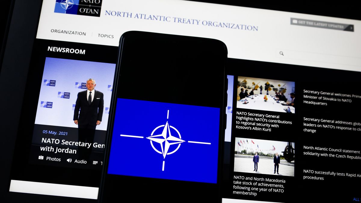 NATO logo is displayed on a mobile phone screen photographed for illustration photo. Gliwice, Poland on May 5, 2021. (Photo by Beata Zawrzel/NurPhoto via Getty Images)