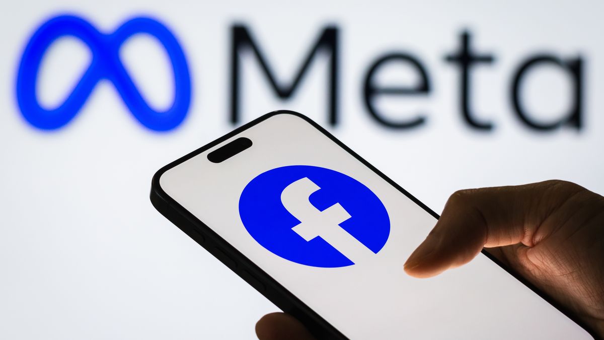 CHONGQING, CHINA - NOVEMBER 6: A smartphone screen displays the Facebook logo, with the Meta company logo in the background, on November 6, 2024 in Chongqing, China. Meta, the parent company of Facebook, has been investing heavily in augmented reality, virtual reality, and the development of the metaverse, aiming to reshape the future of digital interaction. (Photo by Cheng Xin/Getty Images)