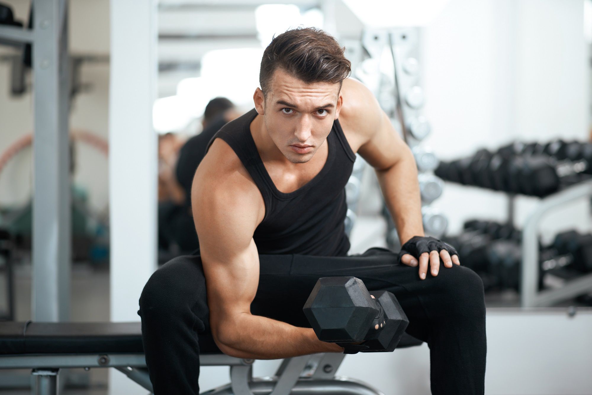 man doing exercises dumbbell bicep muscles in the gymDmytro Vietrov                 exercises, dumbbells, sport, man, guy, caucasian, athlete, sportsman, T-shirt, pants, sweatpants, gym, fitness, white, black, metal, trainer, stand, strong, muscular, young, adult, biceps, hard, muscle, health, activity, lifestyle, barbell, rod, crossbar, coach, handler, exercising, strength, mirror, day, reflection, engaged, indoors, physical, weightlifting, one, weights, body, bodybuilder, human, people, serious
