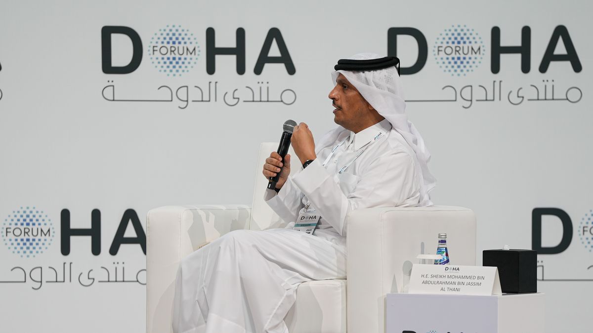 DOHA, QATAR - DECEMBER 07: Qatari Prime Minister and Foreign Minister Mohammed bin Abdulrahman Al Thani (R) answers questions from journalist Tucker Carlson (L) during the 'Newsmaker Interview' session held as part of the Doha Forum 2025 in Doha, Qatar on December 07, 2025. (Photo by Ahmet Turhan Altay/Anadolu via Getty Images)