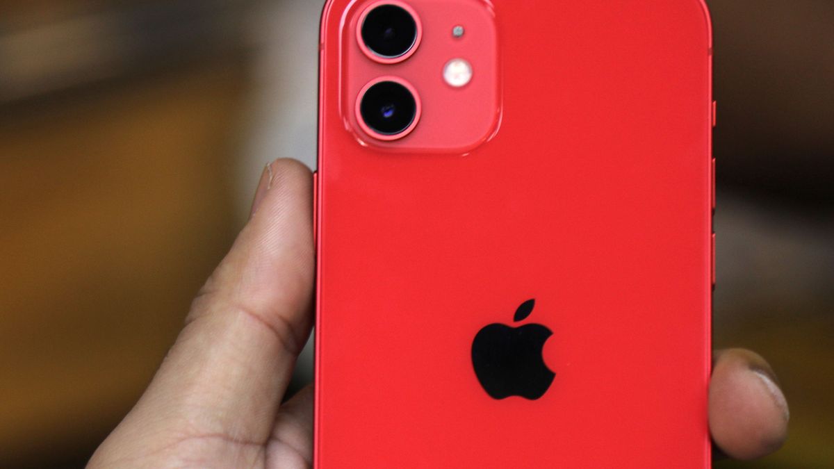 A Palestinian man holds Apple's new iPhone 12 at a mobile phone store in Gaza City on November 14, 2020. Apple's new iPhone 12 is selling well in the Gaza Strip despite inflated prices. (Photo by Majdi Fathi/NurPhoto via Getty Images)