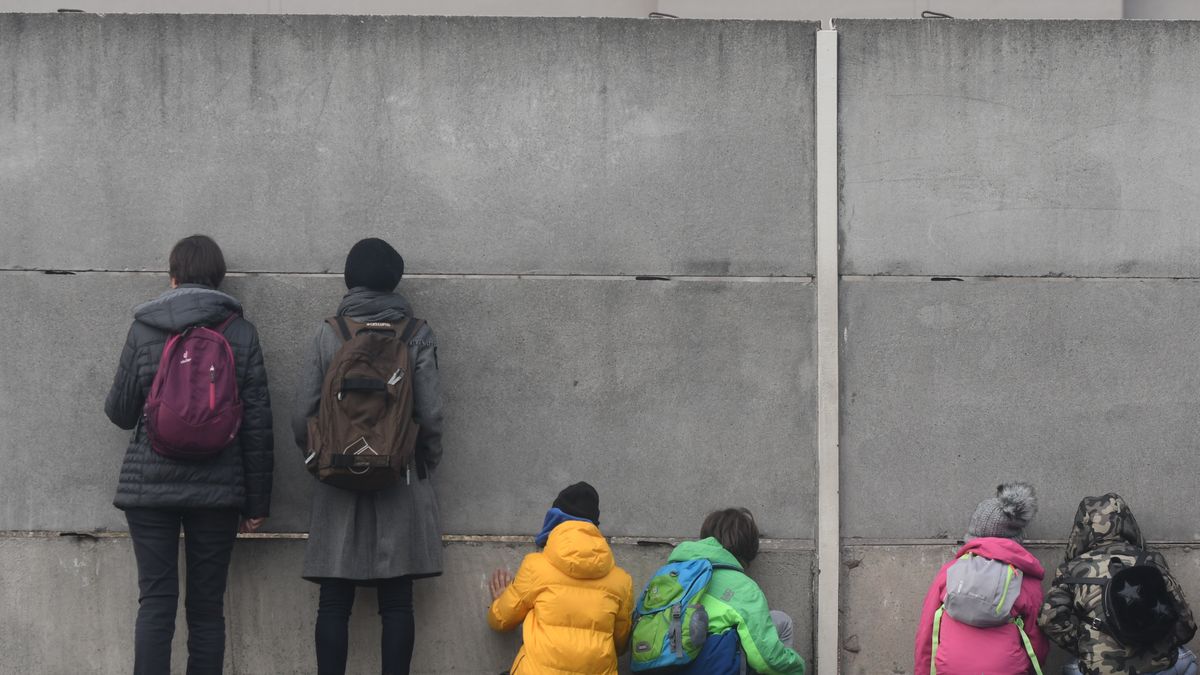 Visitors look through slats in the inner wall into the 'death zone" at a preserved portion of the Berlin Wall at Bernauer Strasse, on the eve of the upcoming 30th anniversary of the fall of the Berlin Wall. 
Germany marks three decades since the fall of the Berlin Wall this week with main celebrations in the German capital on Saturday, November 9, 2019. 
On Friday, November 8, 2019, in Berlin, Germany. (Photo by Artur Widak/NurPhoto via Getty Images)