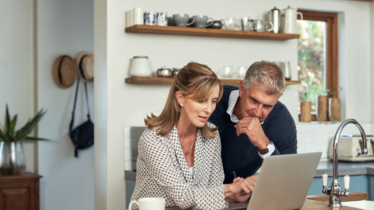 A senior couple planning their finance and paying bills while using a laptop at home. A mature man and woman going through paperwork and working online with a computer
A senior couple planning their finance and paying bills while using a laptop at home. A mature man and woman going through paperwork and working online with a computer
shapecharge