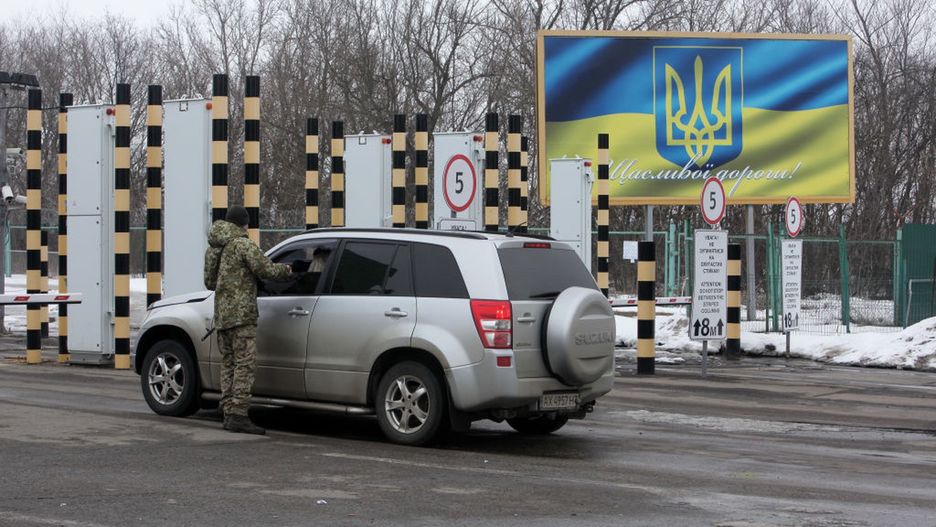 Ukraine-Russia border in Kharkiv RegionKHARKIV REGION, UKRAINE - FEBRUARY 16, 2022 - A border guard talks to a driver at the Hoptivka checkpoint on the Ukraine-Russia border, Kharkiv Region, northeastern Ukraine. (Photo credit should read Vyacheslav Madiyevskyy/ Ukrinform/Future Publishing via Getty Images)Future Publishingukraine crisis, ukraine conflict, ukraine-russia border, ukrainian border guard, ukrainian border guard service, kharkiv region, hoptivka