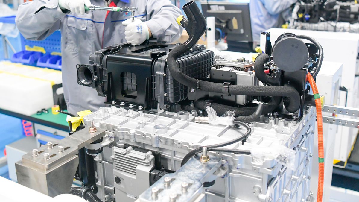 LUOYANG, CHINA - NOVEMBER 15: Workers assemble hydrogen fuel cell engines at Hynamo New Energy Technology Co., Ltd. on November 15, 2024 in Luoyang, Henan Province of China. (Photo by Zhang Yixi/VCG via Getty Images)