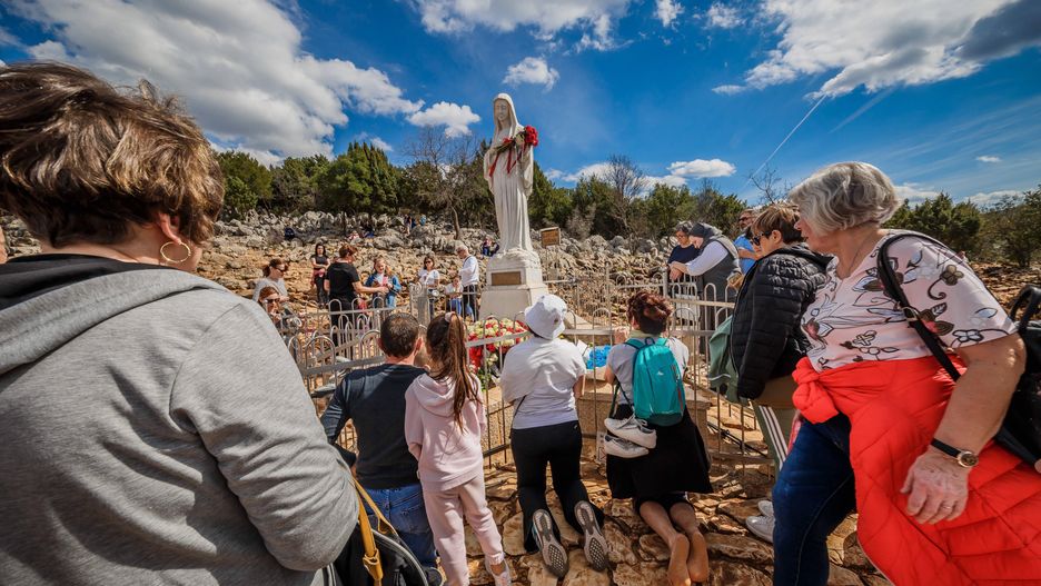 PXL_Medjugorje The Place of Faith
Statue of Virgin  Mary on the the Apparition Hill, in Medjugorie. Almost one million people visit Medjugorje each year, where the Virgin Mary is said to have appeared to six young villagers for the first time on June 24, 1981. For 30 years, the alleged phenomenon was ignored by Roman Catholic authorities until 2010, when Pope Benedict XVI issued an order to form an investigation team to search for the truth in case of Medjugorje sightings. in Medjugorje, Bosnia and Hezegovina on 26. March 2023. Photo: Zvonimir Barisin/PIXSELL 
Dostawca: PAP/PIXSELL
Zvonimir Barisin/PIXSELL
Medjugorje, lady, apparition, pilgrims, Bosnia and Herzegovina, tourism, religious tourism, The Virgin Mary, Catholics, aerial photography, aerial shot, aerial photography, bird view, religia