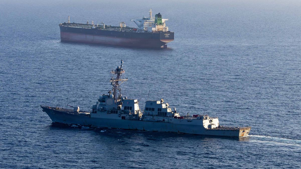 ARABIAN SEA - 26 APRIL: (EDITOR'S NOTE: This Handout image was provided by a third-party organization and may not adhere to Getty Images' editorial policy.) In this handout photo provided by U.S. Central Command, Arleigh Burke-class guided-missile destroyer USS Rafael Peralta (DDG 115) implements a maritime blockade against an Iranian-flagged ship attempting to sail toward an Iranian port, on April 26, 2026 in the Arabian Sea. Rafael Peralta is deployed to the U.S. 5th Fleet area of operations to support maritime security and stability in the Middle East. (Handout photo by U.S. Navy via Getty Images)