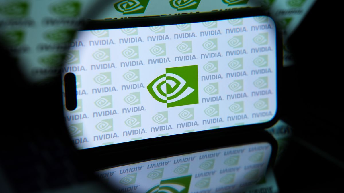 ANKARA, TURKIYE - JUNE 24: In this photo illustration, the NVIDIA' logo is displayed on a mobile phone screen in front of a computer screen displaying NVIDIA icons in Ankara, Turkiye on June 24, 2024. (Photo by Dilara Irem Sancar/Anadolu via Getty Images)