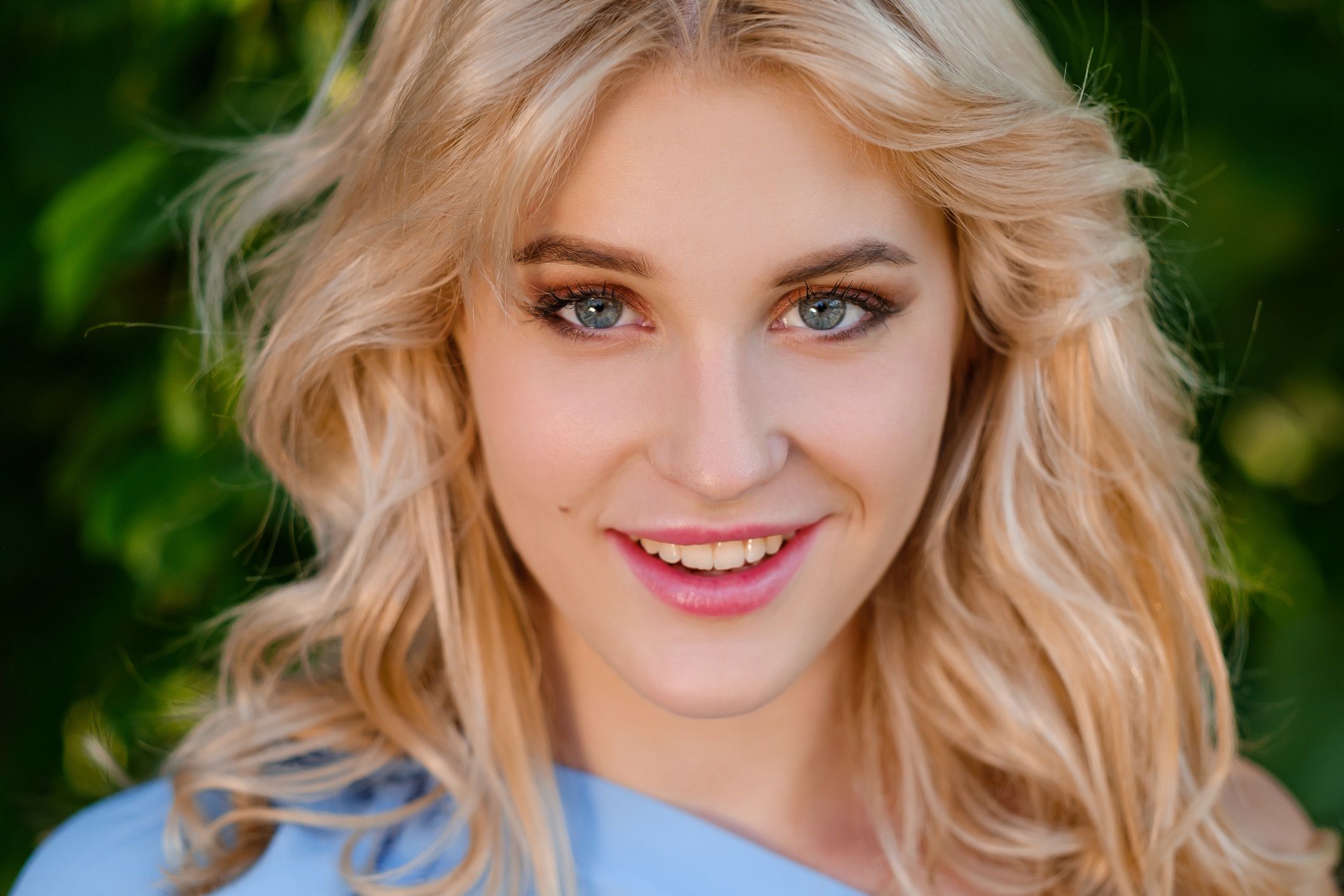 Portrait of a young beautiful girl 21 years old in a blue summer dress with a white belt bag. The woman smiles. Beautiful lips and eyes. Long loose hair.
Portrait of a young beautiful girl 21 years old in a blue summer dress with a white belt bag. The woman smiles. Beautiful lips and eyes. Long loose hair, natural beauty.
Mikhail Spaskov