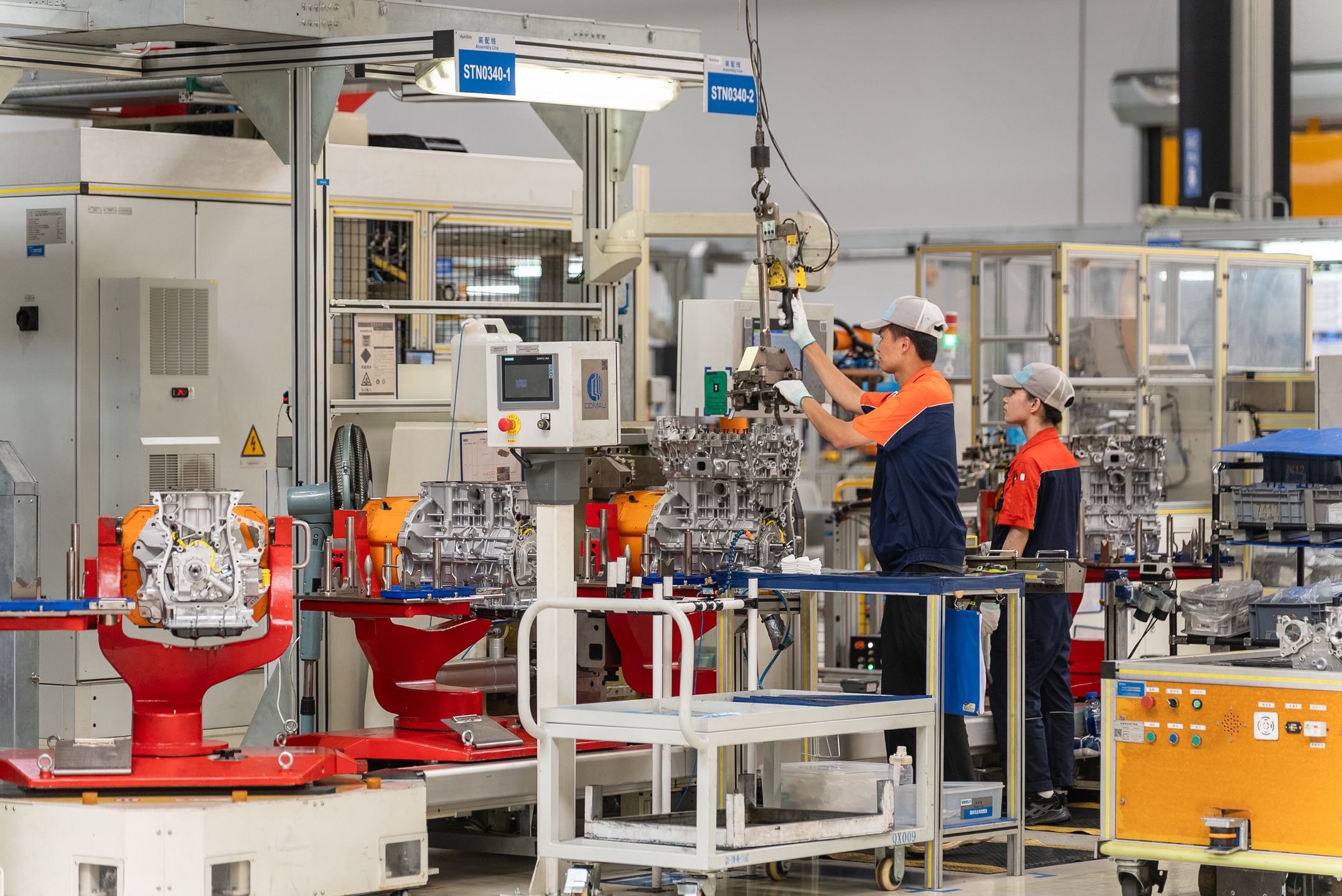 YIWU, CHINA - JUNE 17: A technician assembles M252 engine at the workshop of Zhejiang Yili Automobile Components Co., Ltd. on June 17, 2025 in Yiwu, Zhejiang Province of China. The M252 engine, which was jointly developed by Geely Automobile and Mercedes-Benz, will be exported to Germany. (Photo by VCG/VCG via Getty Images)