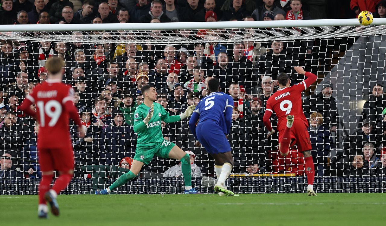 LIVERPOOL, ENGLAND - JANUARY 31: Darwin Nunez of Liverpool heads the ball at goal only to hit the crossbar during the Premier League match between Liverpool FC and Chelsea FC at Anfield on January 31, 2024 in Liverpool, England. (Photo by Clive Brunskill/Getty Images)