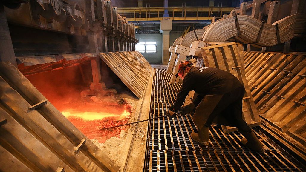 Aluminum Manufacture At United Co. Rusal's Irkutsk Smelter
A worker uses a tool to move molten aluminum in the electrolysis bath inside the electrolysis shop at the Irkutsk aluminium smelter, operated by United Co. Rusal, in Shelekhov, Russia, on Monday, Sept. 21, 2015. The biggest aluminum producers are discussing the introduction of a "green" trademark for the lightweight metal that could be sold at a premium and encourage carbon footprint reductions among rivals, United Co. Rusal's deputy chief executive officer said. Photographer: Andrey Rudakov/Bloomberg via Getty Images
Bloomberg
EMEA; EUROPE, EAME; EUROPE; RUSSIA; USSR, RUSSIA; RUSSIAN, INDUSTRY: INDUSTRIAL; FACTORY, ALUMINIUM; METAL; METALS, JOB; JOBS; EMPLOYMENT, TOPNEWS, BEST PHOTOS; BEST PHOTO