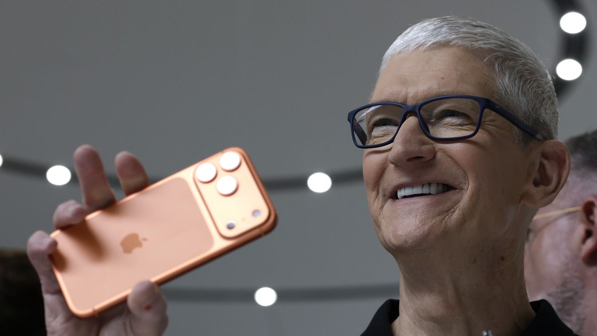 CUPERTINO, CALIFORNIA - SEPTEMBER 09: Apple CEO Tim Cook holds up a new iPhone 17 Pro during an Apple special event at Apple headquarters on September 09, 2025 in Cupertino, California. Apple unveiled a new generation of iPhones and updated Apple Watches and AirPods during a special event at Apple headquarters.  (Photo by Justin Sullivan/Getty Images)