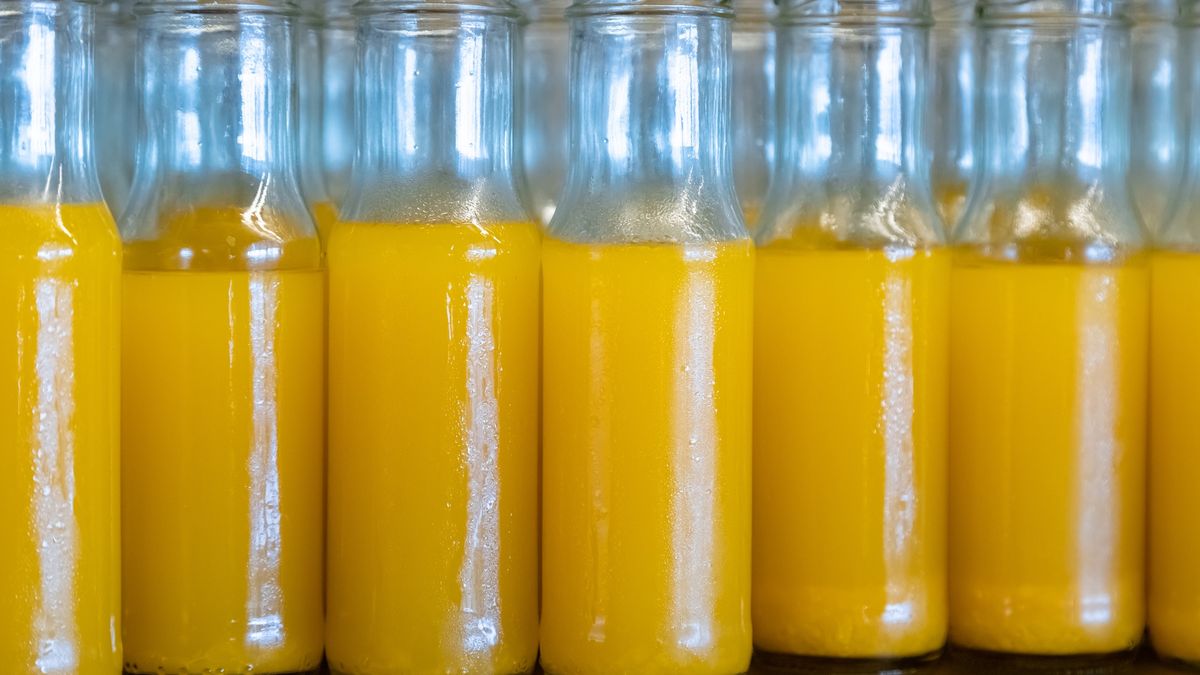 Bottle of orange juice in the refrigeratoBottle of orange juice in the refrigerato.Prasert Krainukul