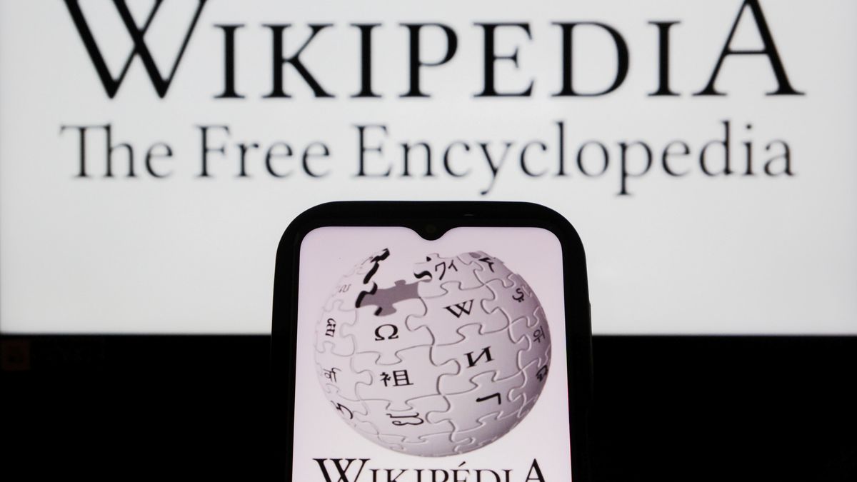 INDONESIA - 2025/10/31: In this photo illustration, a Wikipedia logo is displayed on a smartphone and in the background. (Photo Illustration by Algi Febri Sugita/SOPA Images/LightRocket via Getty Images)