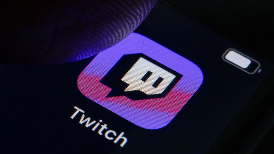 BERLIN, GERMANY - OCTOBER 11: In this photo illustration the logo of live streaming video platform Twitch is displayed on a smartphone on October 11, 2019 in Berlin, Germany. (Photo Illustration by Thomas Trutschel/Photothek via Getty Images)