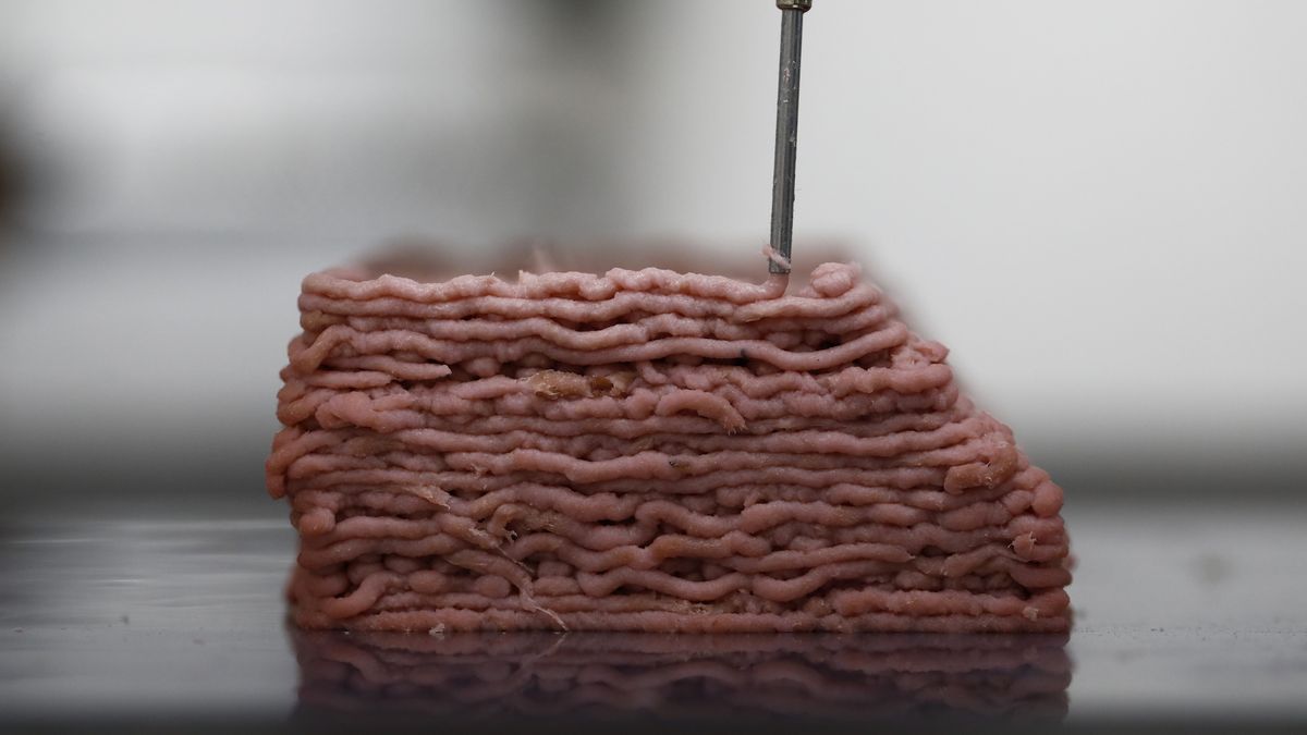 Bloomberg Pictures Of The Year 2019: Tech Unchecked. A 3D printer prints a variation of animal-free meat muscle formulation with colour in the laboratories of Redefine Meat Ltd., in Ness Ziona, Israel, on Monday, Nov. 18, 2019. The march of technology has become a cliche. There were advances designed to make our lives easier, make them more exciting, keep track of us with facial-recognition technology and also replace us. Food is now produced in a way it never used to be with 3D printer technology and Cubic farming. Photographer: Corinna Kern/Bloomberg via Getty Images