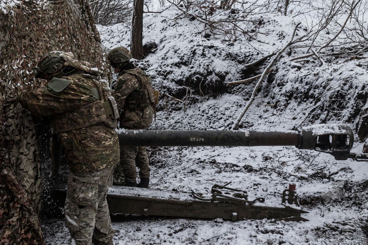 DONETSK OBLAST, UKRAINE - FEBRUARY 19: Ukrainian soldiers of the 'Tsunami' regiment remove camouflage from artillery in the direction of Bakhmut, as the Russia-Ukraine war continues in Donetsk Oblast, Ukraine on February 19, 2024. (Photo by Diego Herrera Carcedo/Anadolu via Getty Images)