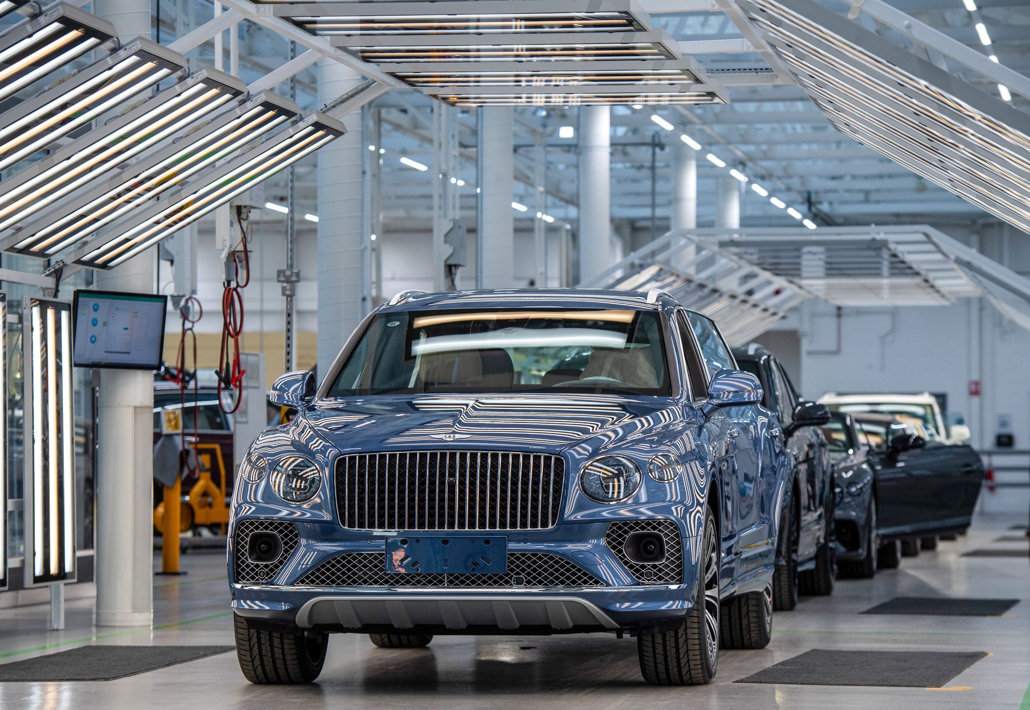 A Bentley Bentayga sport utility vehicle in the final inspection area on the production line at the Bentley Motors Ltd. headquarters in Crewe, UK, on Wednesday, Dec. 7, 2022. Bentley plans to offer only plug-in hybrid and electric cars by 2026 and switch its entire lineup to fully battery-powered vehicles by the end of the decade. Photographer: Chris J. Ratcliffe/Bloomberg via Getty Images