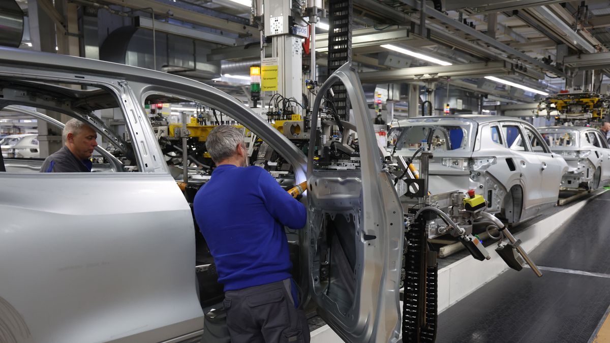 WOLFSBURG, GERMANY - MARCH 07: Workers assemble cars on the assembly line at the Volkswagen automobile factory on March 07, 2025 in Wolfsburg, Germany. The factory, which produces the gasoline-powered and hybrid Golf, Tiguan, Touran and Tayron models, churns out over half a million cars a year. Volkswagen faced a sharp decline in global sales last year. The company is seeking to reduce its work force and possibly close some of its German factories. Production at the Wolfsburg plant, however, rose in 2024. (Photo by Sean Gallup/Getty Images)