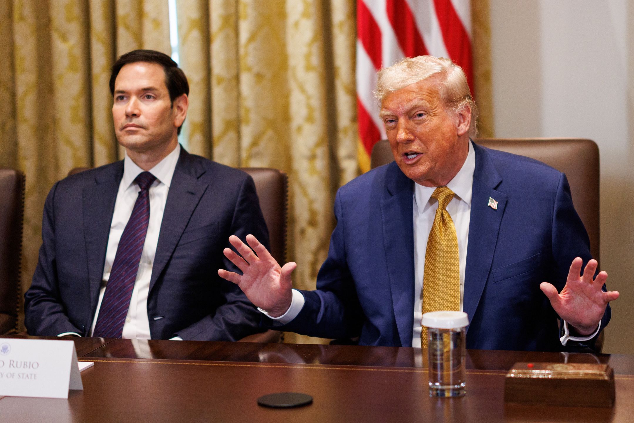 Marco Rubio, US secretary of state, left, and US President Donald Trump during a cabinet meeting at the White House in Washington, DC, US, on Tuesday, July 8, 2025. Trump said his administration is weighing whether to take control of the city of Washington, DC, to help combat crime, in a move that would represent a dramatic upheaval to the capital's half-century of home rule. Photographer: Aaron Schwartz/CNP/Bloomberg via Getty Images