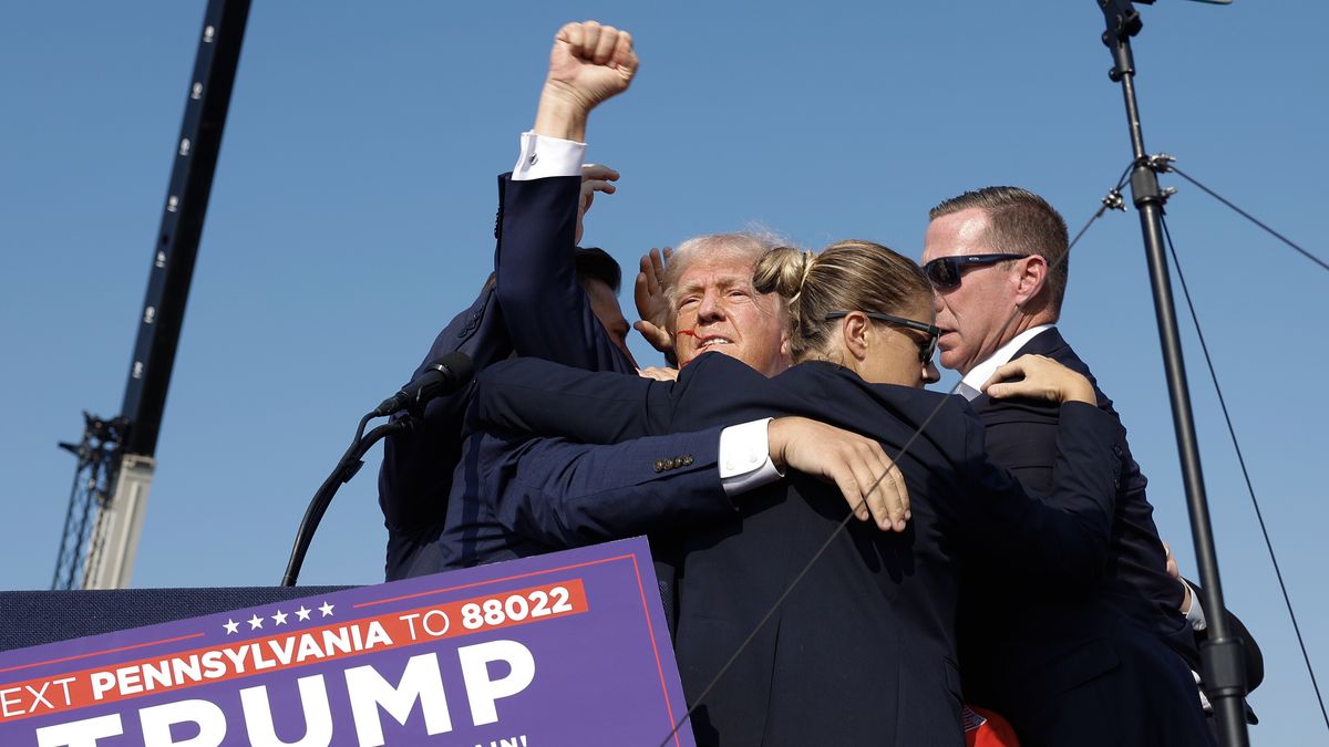 BUTLER, PENNSYLVANIA - JULY 13: Republican presidential candidate former President Donald Trump pumps his fist as he is rushed offstage during a rally on July 13, 2024 in Butler, Pennsylvania. (Photo by Anna Moneymaker/Getty Images)