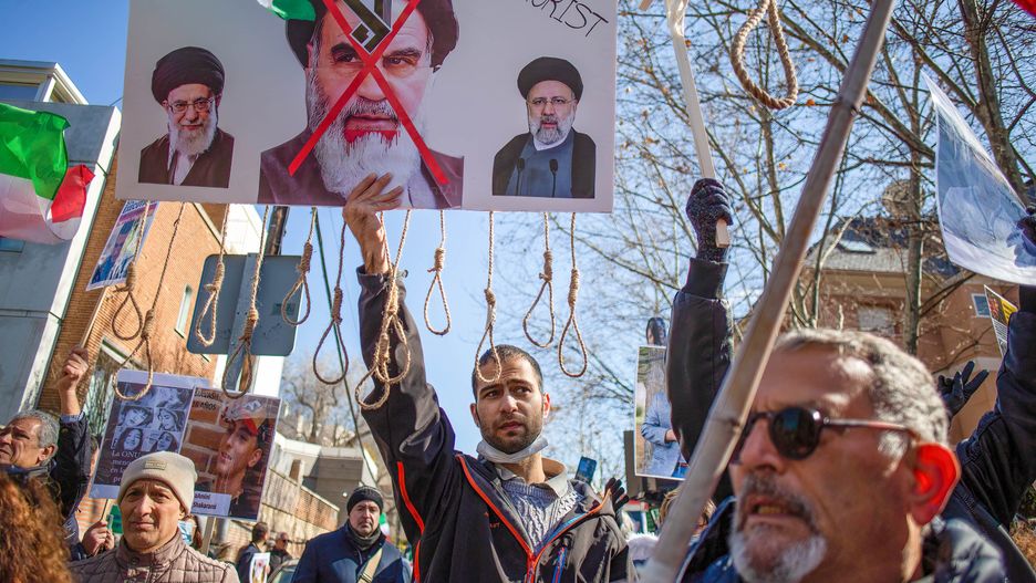MADRID, SPAIN - 2023/02/11: In the center, a protester holds a placard with the image of former Iranian political and religious leader Ayatollah Khomeini during a demonstration of the Iranian population in Madrid, against the regime of Ebrahim Raisi president of the Republic of Iran. On February 11, 1979, the Ayatollah Khomeini announced the triumph of the Islamic revolution and the overthrow of the Shah of Persia. (Photo by Luis Soto/SOPA Images/LightRocket via Getty Images)