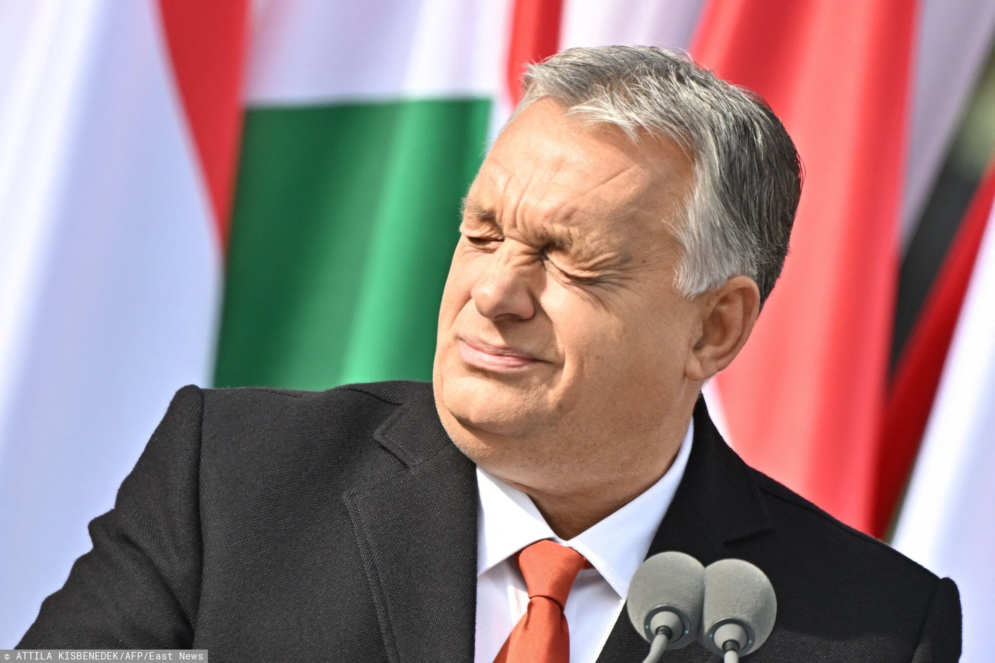 Temporary
Hungary's Prime Minister Viktor Orban reacts as he delivers a speech during an event to commemorate the 66th anniversary of the Hungarian uprising against the Soviet occupation, in front of the Mindszethyneum House, a newly inaugurated memorial of the clerical leader of the revolution, cardinal Jozsef Mindszenthy, in Zalaegerszeg, Hungary, on October 23, 2022. - The uprising began in Budapest after a student demonstration on October 23, 1956 and had been crushed on November 4 by Soviet Red Army tanks. More than 2,000 civilians were killed during the fighting, while around 200,000 people fled the country. (Photo by Attila KISBENEDEK / AFP)
ATTILA KISBENEDEK